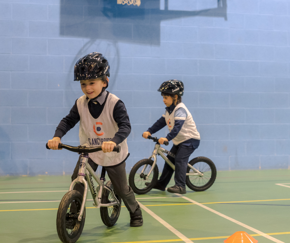Riders learn the fundamentals involved in learning to ride a bike.